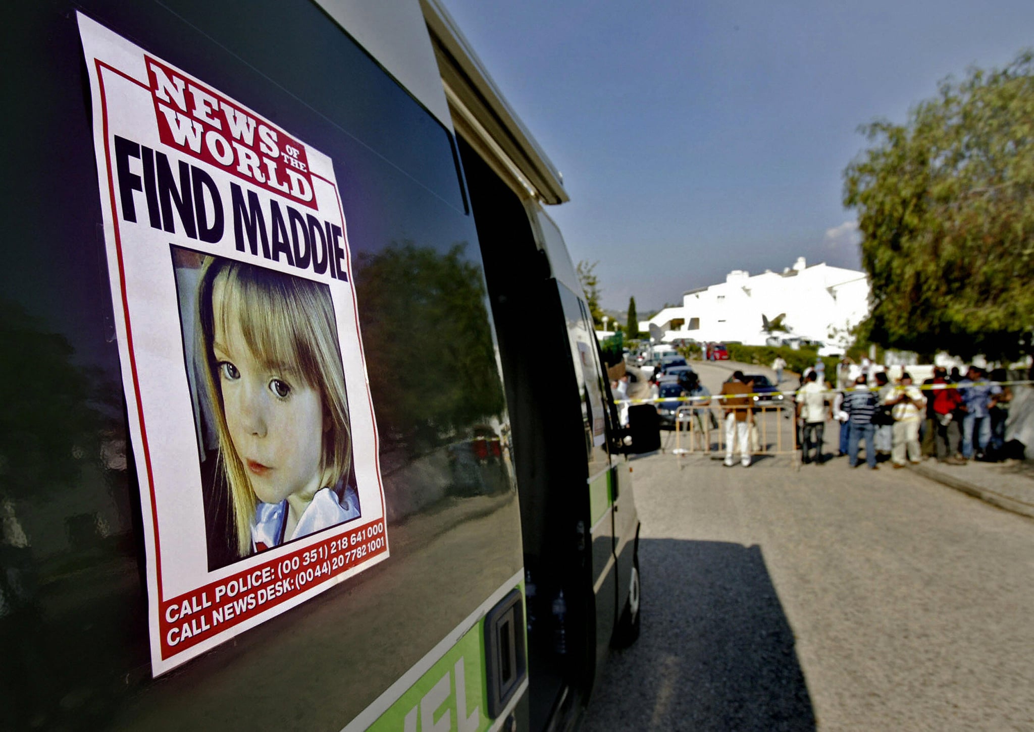 Lagos, PORTUGAL: A poster placed on a van shows the picture of three-year old British girl Madelaine McCann outside the Ocean club apartment hotel in Praia de Luz 05 May 2007, in Lagos. A team of three British police detectives arrived in Portugal today to help track down a suspected kidnapper believed to have abducted the British toddler.  AFP PHOTO/ Vasco CELIO (Photo credit should read VASCO CELIO/AFP/Getty Images)