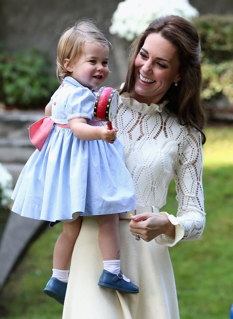 During the Cambridges' trip to Canada in 2016, Charlotte wore a sweet blue dress with a pink bow, perfect for a day of activities.