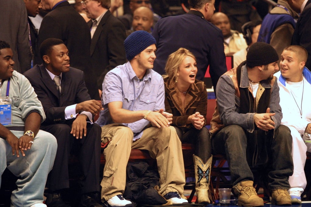 Justin Timberlake sat courtside with Chris Tucker, Chris Kirkpatrick, and then-girlfriend Britney Spears at the NBA All-Star Game in February 2002.