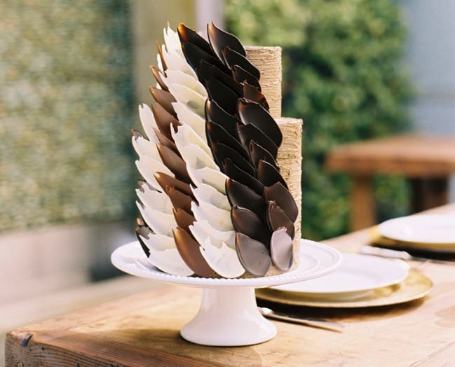 This simple two-tiered cake is given an edgy touch with carefully placed chocolate petals — stunning!