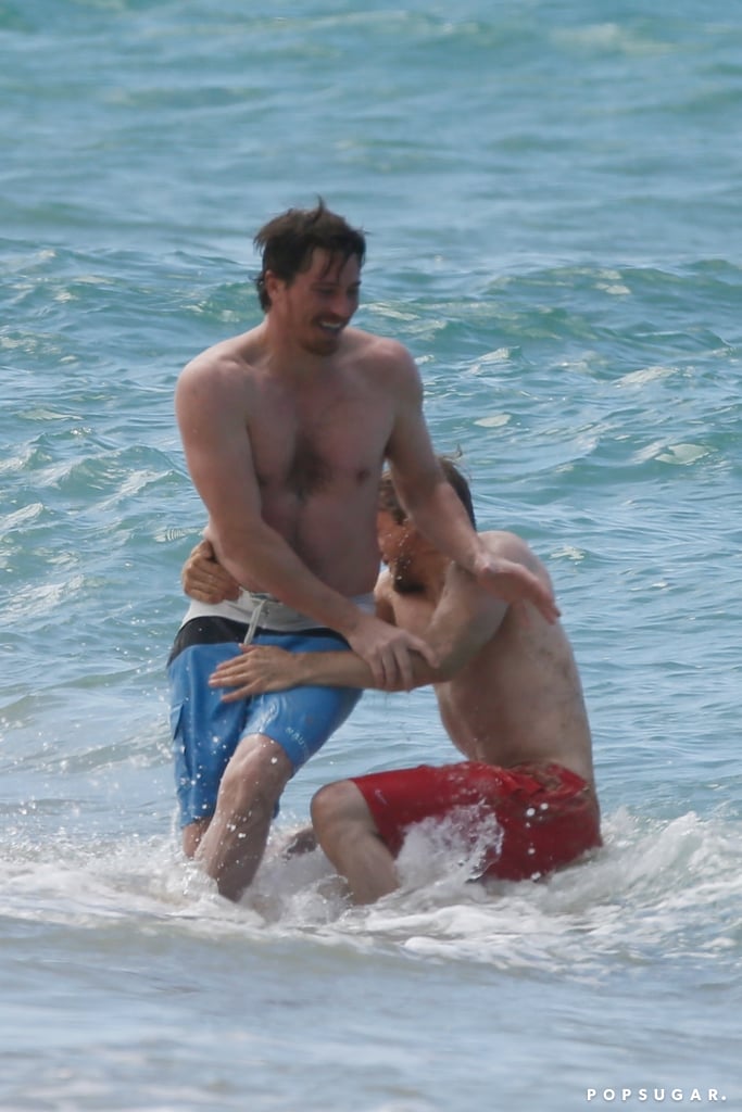 Charlie Hunnam and Garrett Hedlund Wrestle in Hawaii Photos. 