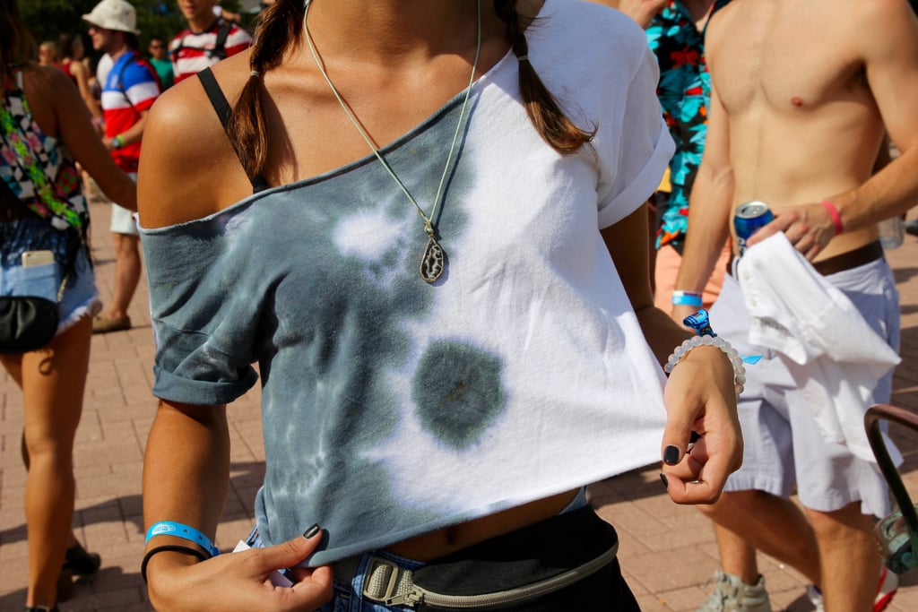 Lollapalooza attendees are crafty! This woman cut the neck off a basic white tee and hand-dipped it for a perfect tie-dyed look.