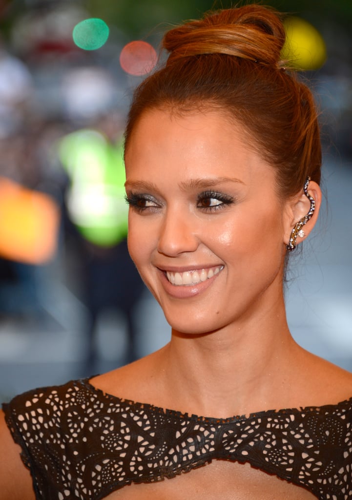 Jessica Alba offset a high bun with an edgy, embellished piece covering the whole of her ear at the Met Gala.