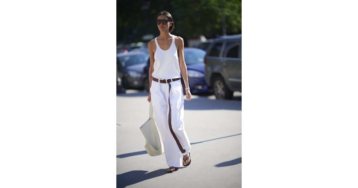 Try Plain Flip-Flops With Baggy White Jeans, a Long Belt, and a Tank ...
