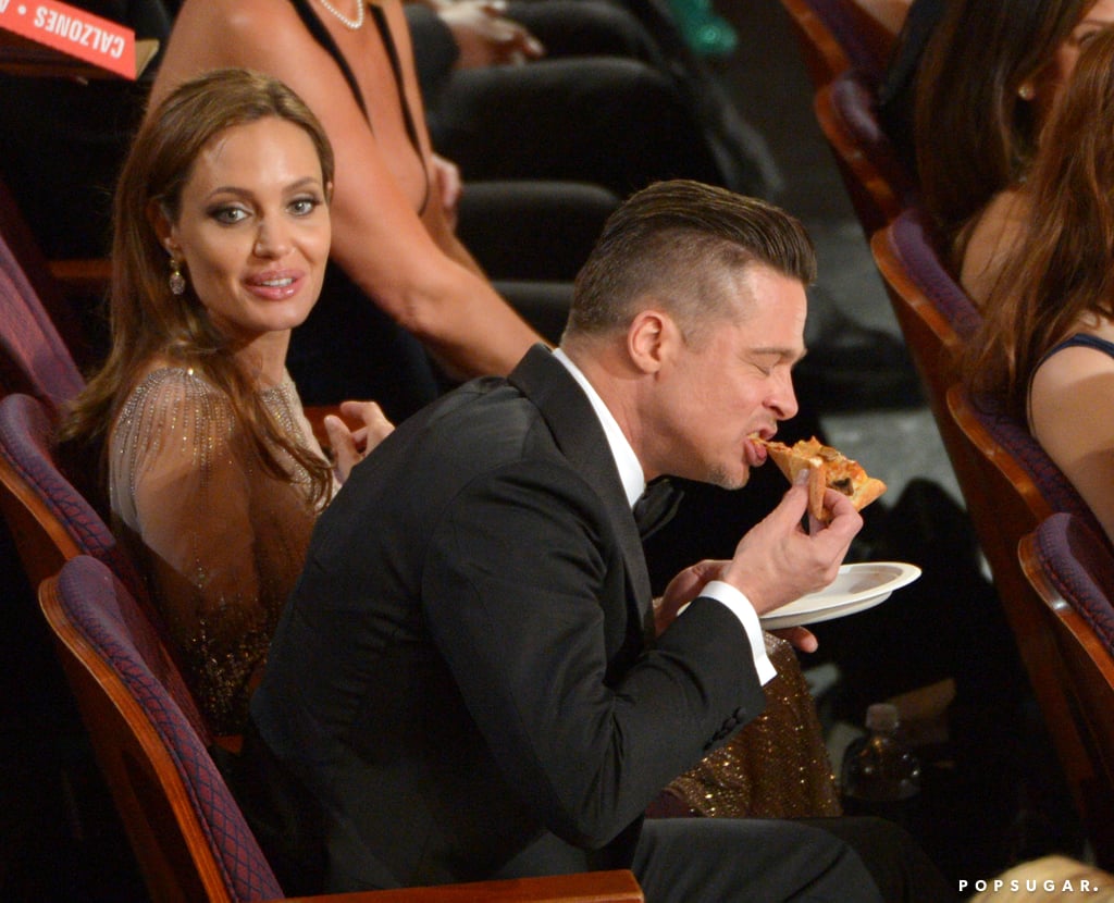 Brad Pitt chowed down on a slice while Angelina Jolie looked on.