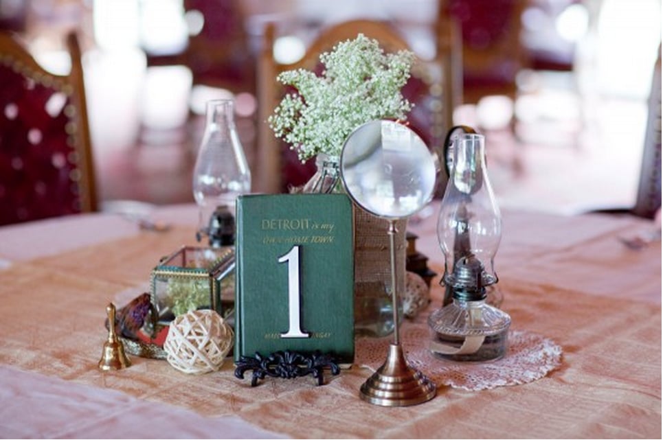 Instead of spending hours reviewing options at the florist, spend time trolling antique stores for an eclectic mix of table-worthy pieces. 
Photo by Stephanie N. Baker via Wedding Chicks