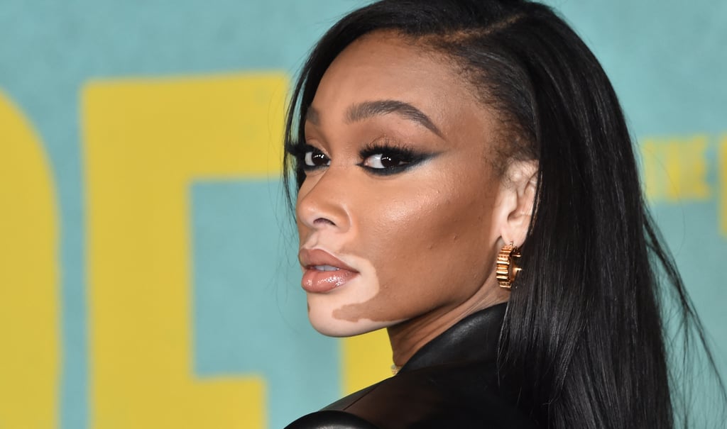 Winnie Harlow Wears a Black Leather Versace Blazer Dress