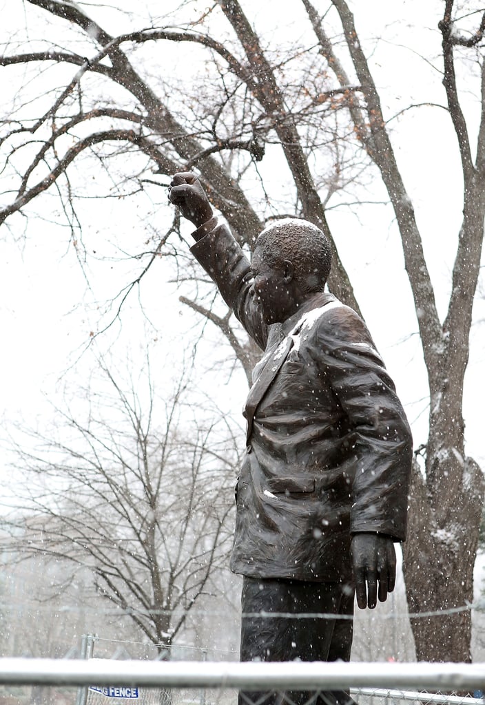 Snow fell on a Nelson Mandela statue outside the South African Embassy in Washington DC.