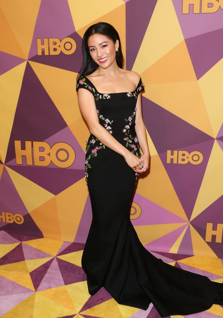 At the HBO Golden Globe Awards afterparty wearing a slightly off-shouldered black gown by Zac Posen.