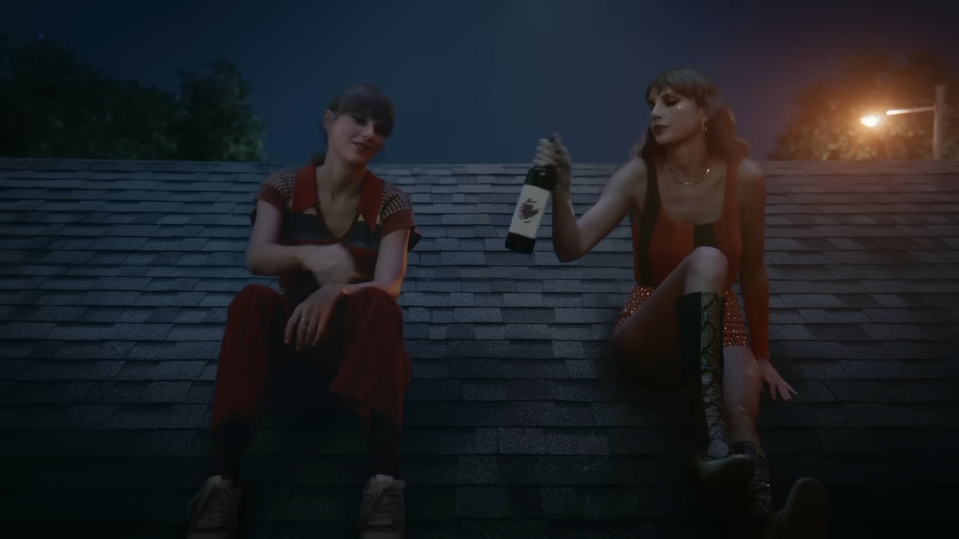 Two Taylor Swifts sitting on the roof in 