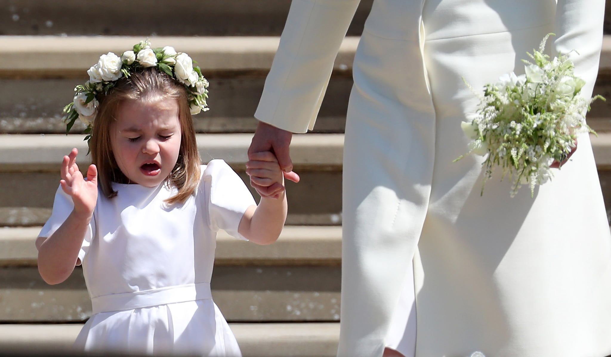 WINDSOR, UNITED KINGDOM - MAY 19:  Princess Charlotte of Cambridge stands on the steps with her mother Catherine, Duchess of Cambridge after the wedding of Prince Harry and Ms. Meghan Markle at St George's Chapel at Windsor Castle on May 19, 2018 in Windsor, England. (Photo by Jane Barlow - WPA Pool/Getty Images)