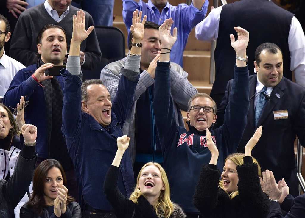 Tom Hanks and Brian Williams were really feeling the hockey game between the Boston Bruins and New York Rangers in NYC on Wednesday.