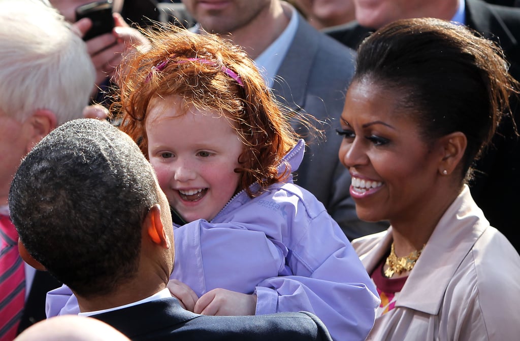 Barack and Michelle Obama greeted a young girl in Dublin, Ireland, during a public rally in May 2011.