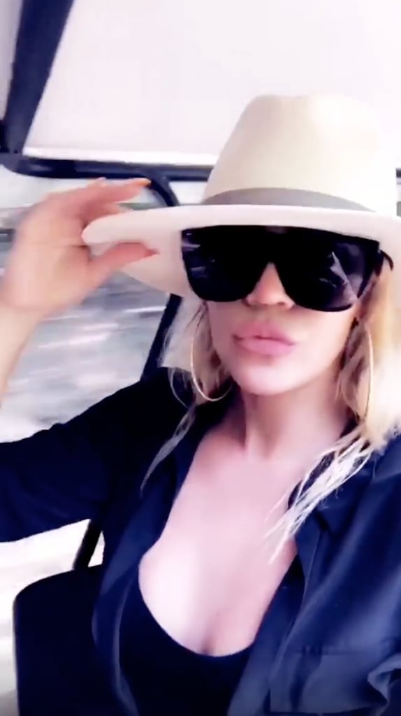 Khloé Wore Oversize Sunglasses, a Black One-Piece, and a Sun Hat