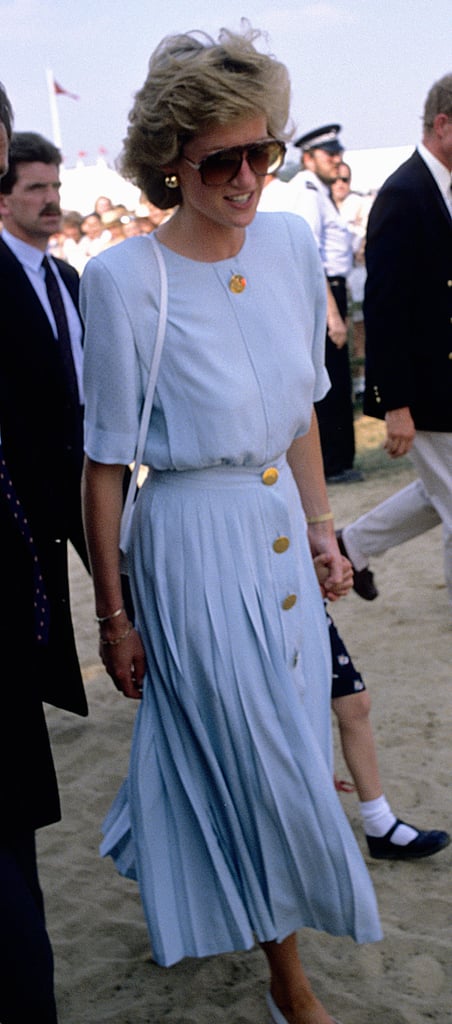 Sporting her favorite aviators once again, Diana wore a matching cornflower blue blouse and pleated skirt to the Windsor Polo.