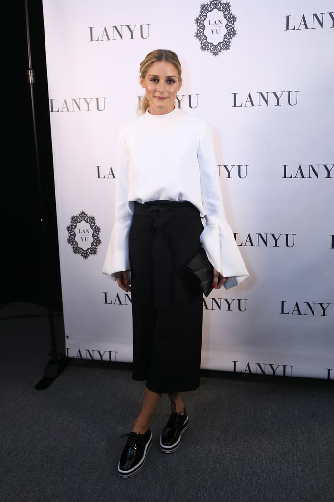 Backstage at Lanyu, Olivia showed off the designer's pieces, completing the look with black Sol Sana oxfords.