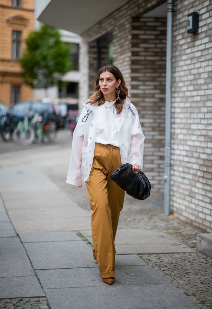 Complete a simple blouse and trouser combination with an oversize Bottega clutch.