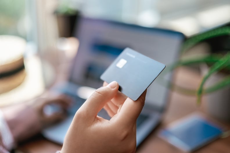 woman holding credit card