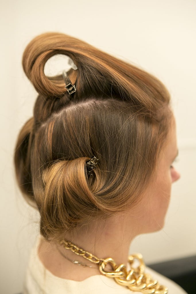 Twist the top section away from your face, and set the curl with a pin. Let your hair set while it cools — this is the perfect time to do your makeup! Halpin sprayed the pin curls with a flexible-hold hair spray, Oribe Superfine Hair Spray ($36).
Source: Caroline Voagen Nelson