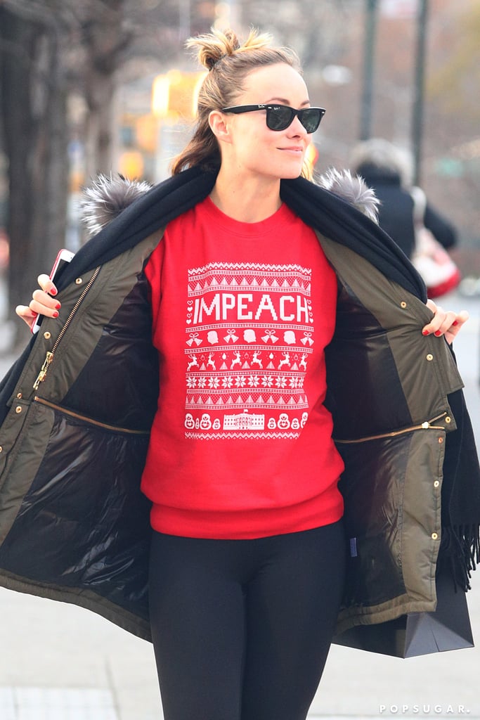 Olivia Wilde Wearing "Impeach" Holiday Sweater 2017