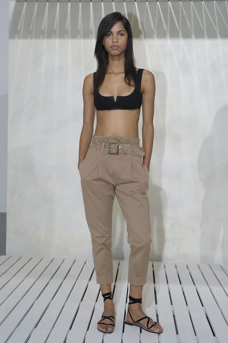 High-waisted trousers and a crop top.