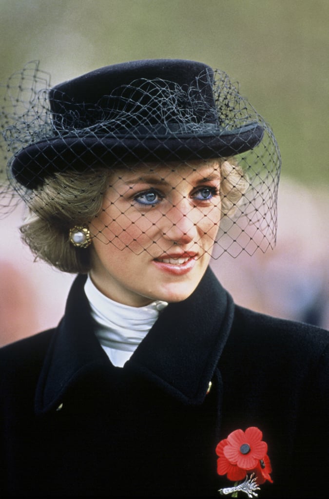 While attending a commemoration service for the Arc de Triomph in Paris in 1988, Diana paid her respects in style with a black Jasper Conran coat, lined with gold buttons, and a black Viv Knowland hat with netting, along with a remembrance poppy.