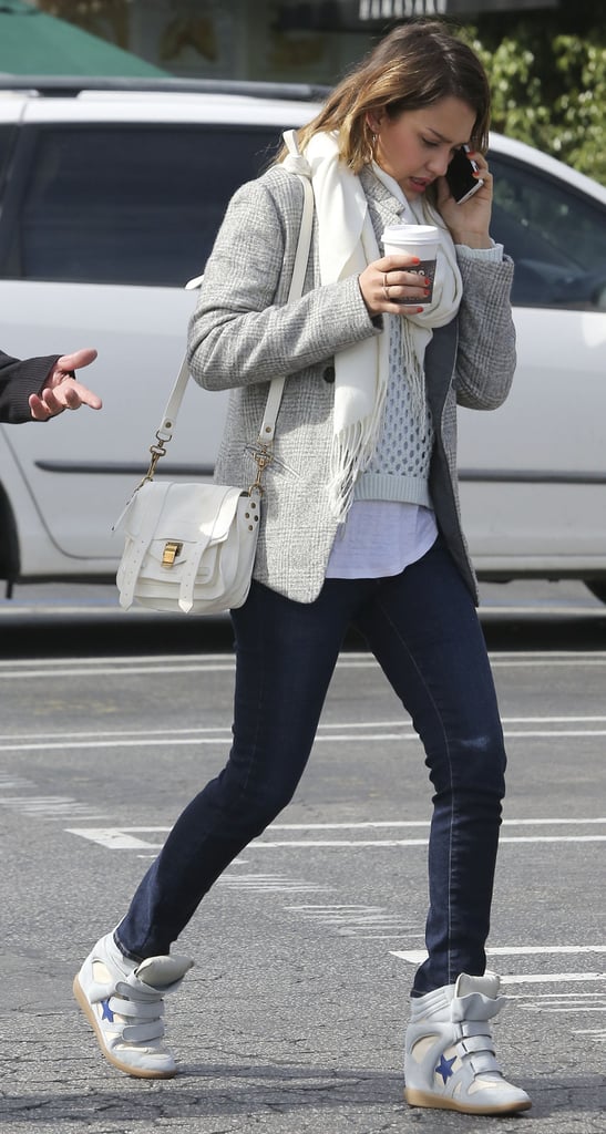 Jessica accessorized her neutral LA ensemble, including dark skinnies, with Isabel Marant sneakers and a mini Proenza Schouler bag.