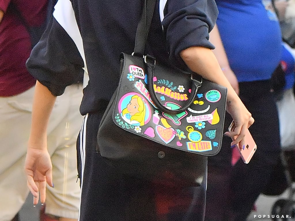 Selena Gomez's Alice in Wonderland Bag at Disneyland