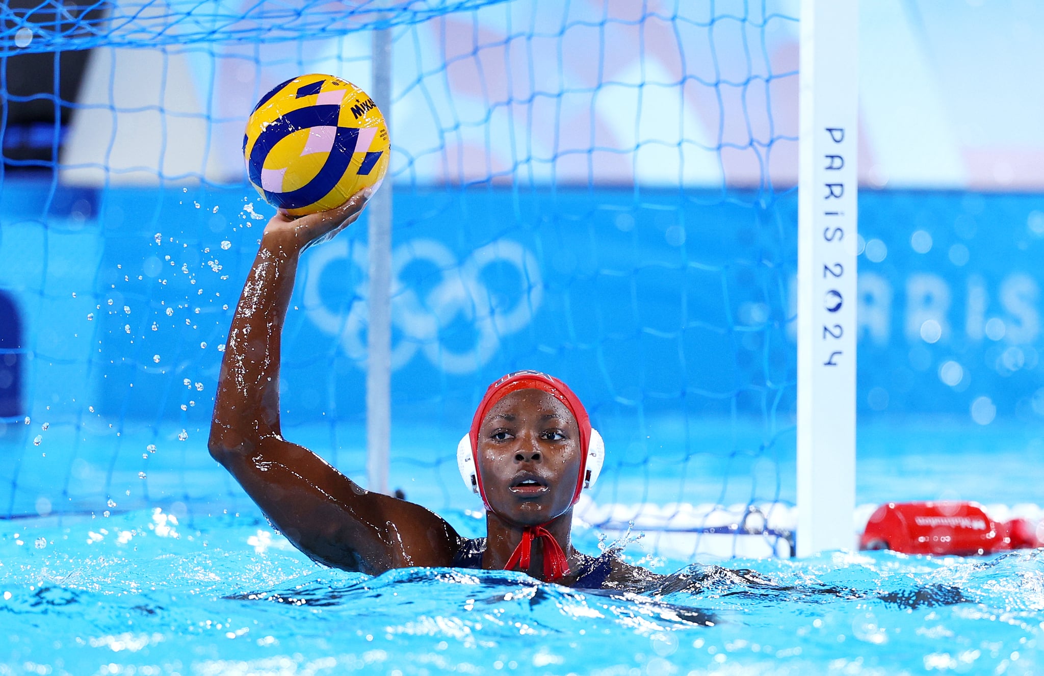 PARIS, FRANCE - JULY 29: Ashleigh Johnson of Team United States looks on during the Women's Preliminary Round - Group B match between Team United States and Team Spain on day three of the Olympic Games Paris 2024 at Aquatics Centre on July 29, 2024 in Paris, France. (Photo by Clive Rose/Getty Images) PARIS, FRANCE - JULY 29: Ashleigh Johnson of Team United States looks on during the Women's Preliminary Round - Group B match between Team United States and Team Spain on day three of the Olympic Games Paris 2024 at Aquatics Centre on July 29, 2024 in Paris, France. (Photo by Clive Rose/Getty Images)