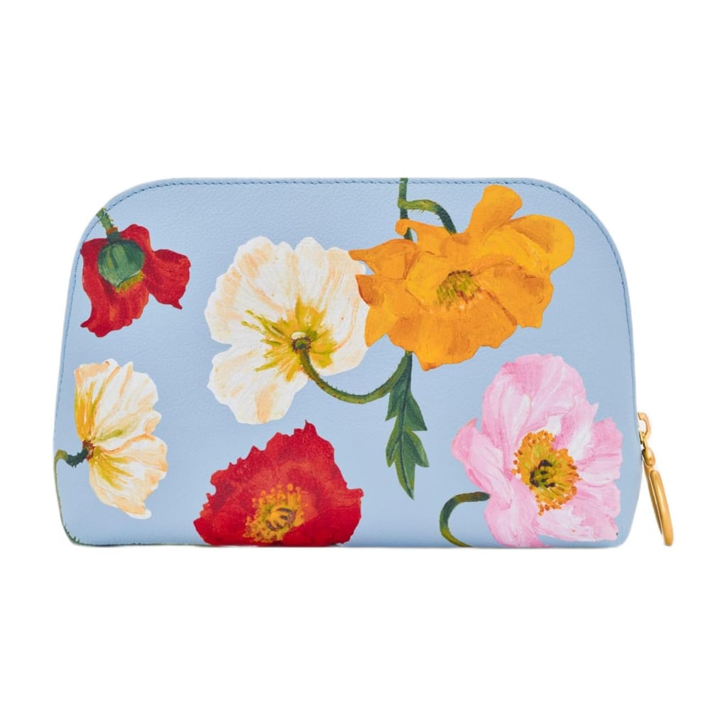 Oscar de la Renta Poppy-Printed Medium Cosmetic Case ($690)
Oscar de la Renta florals are iconic for a reason, and this poppy-printed cosmetic case taps right into that legacy. The bold floral design feels timeless yet playful, while the structured silhouette keeps your beauty essentials polished and organized.