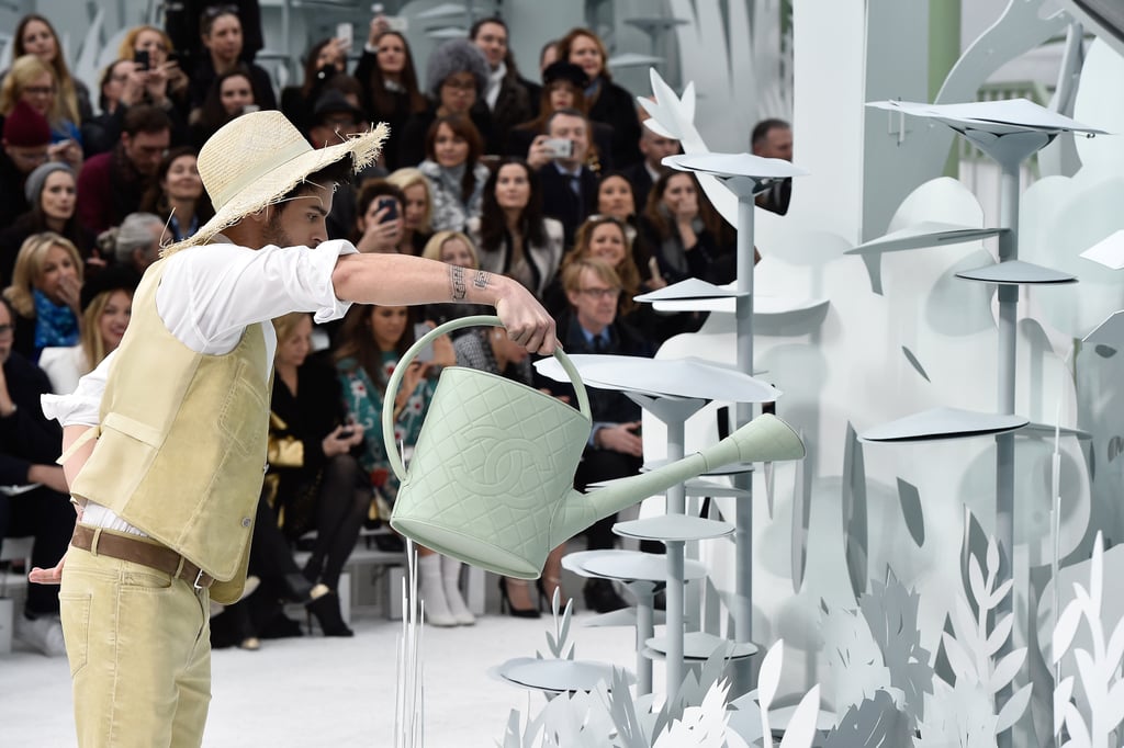 And real-life "gardeners," holding Chanel watering cans.