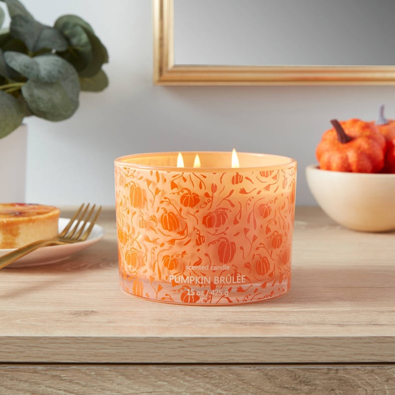 A Statement Candle: Opalhouse Lidded Glass Jar Orange Pumpkin Print 3-Wick Pumpkin Brulee Candle