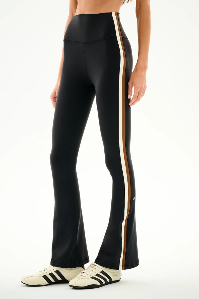Splits59 Raquel High Waist Supplex Flare ($134)
Call them flared leggings or yoga pants (shout-out, millennials), these bell bottoms are a great alternative to traditional workout pants. The racing stripe detail along either side will lend a lengthening effect, which can be helpful as you watch your form during any type of exercise. 
Pros: The soft compression fabric will hold you in while the fun stripe accent gives a flattering, lengthening effect. 
Cons: If you prefer a traditional legging, the flared bottoms may not be up your alley. 
Material: Nylon and spandex. 
Length: 30", 32", or 34"
Colorways: 4
Sizes: XS-XXL
Who it's best for: Those who want a versatile, fashionable workout pant that can be used for any form of exercise.