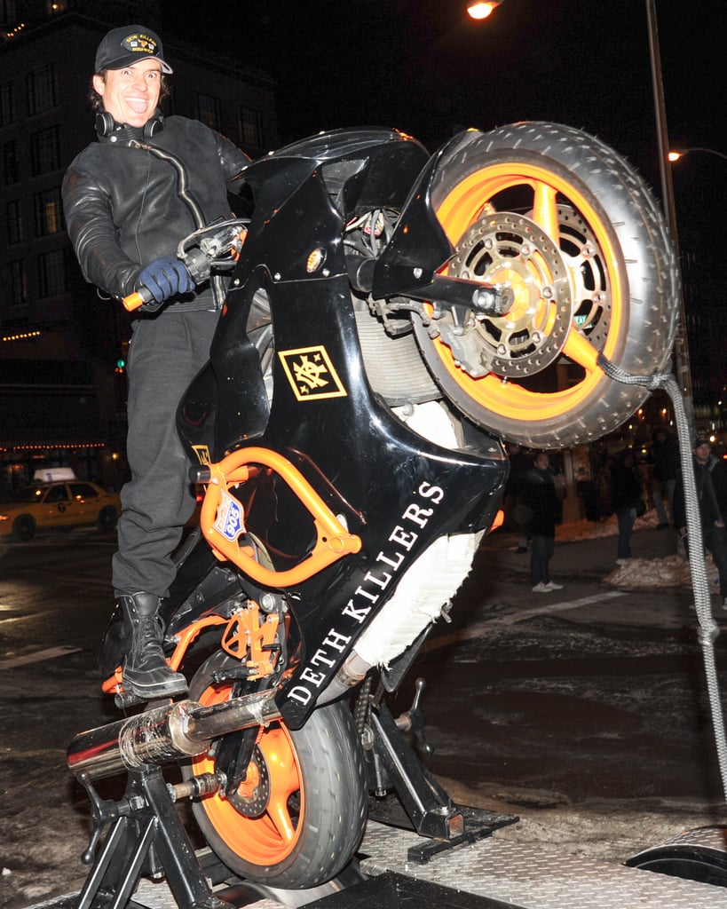 Orlando Bloom played around on a motorcycle at a store opening on Tuesday in NYC.