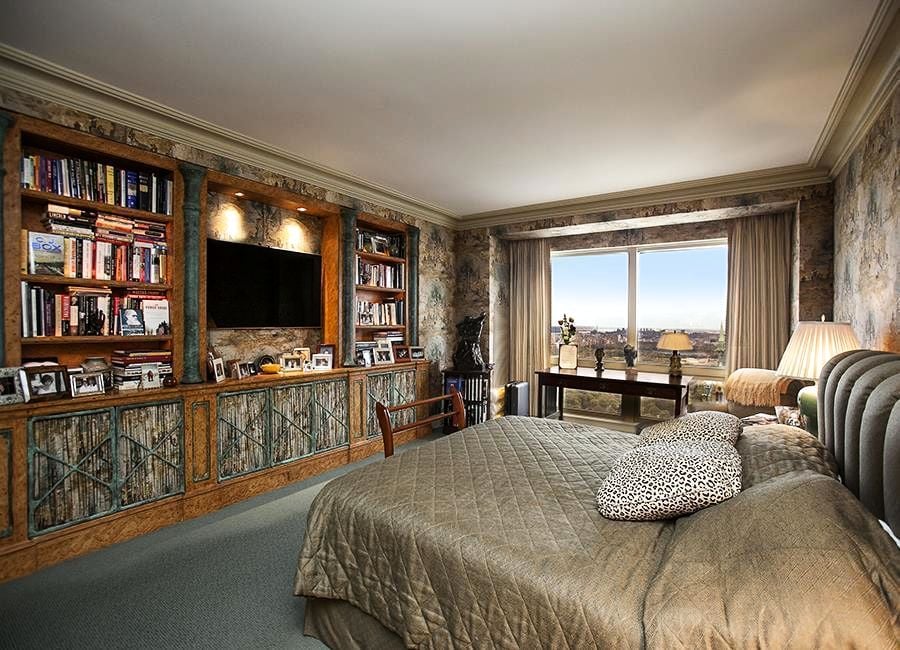The bedroom features numerous built-ins.