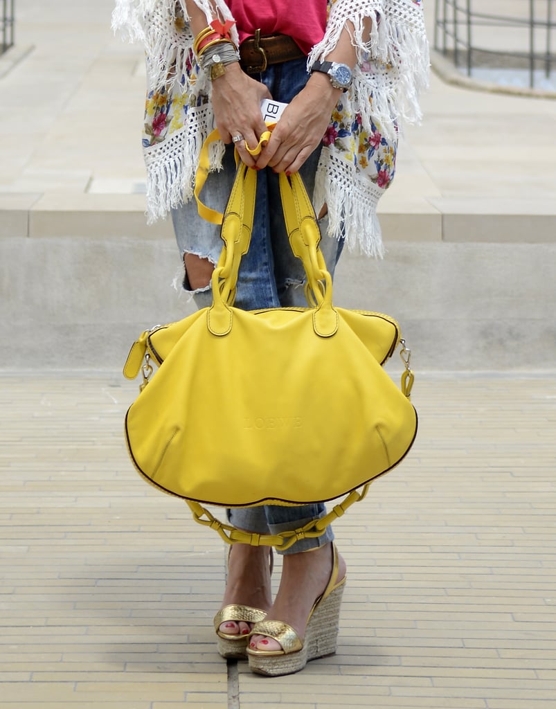 There's nothing hotter than fringe, and mixing with a bold-colored bag and cute sandals makes you look like you just walked off a sandy beach in Rio.