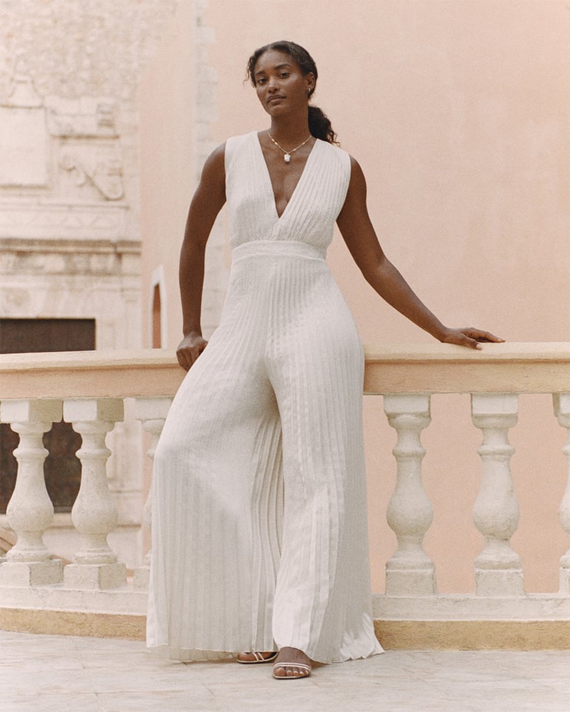 Swap a traditional ivory dress for a high-impact jumpsuit. This option's plunging neckline, pleated wide-legs, and open back make a bold statement that'll set you apart from all the other brides this season. 


Giselle Pleated Jumpsuit ($140).