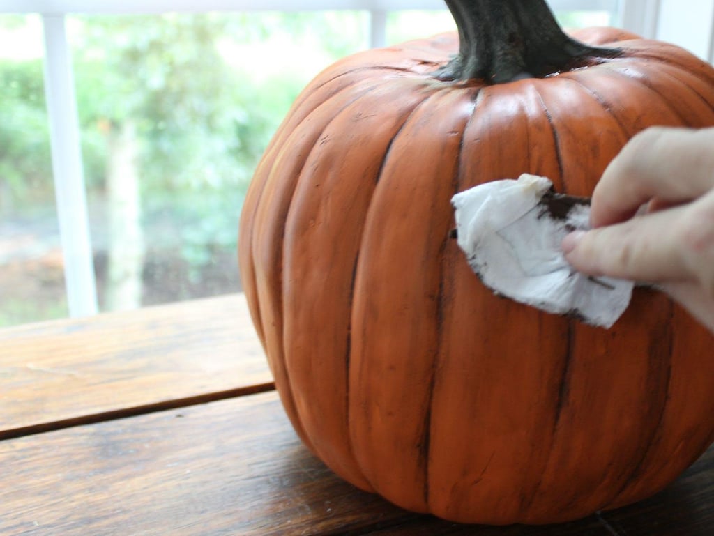 Gently wipe up and down over the paint to create the smudged, authentic look of the pumpkin.