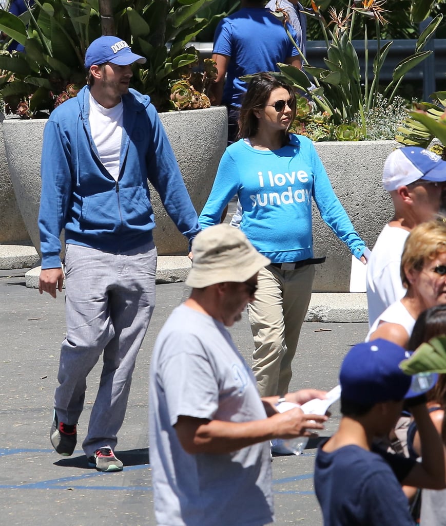 Ashton Kutcher and Mila Kunis at a Dodgers Game