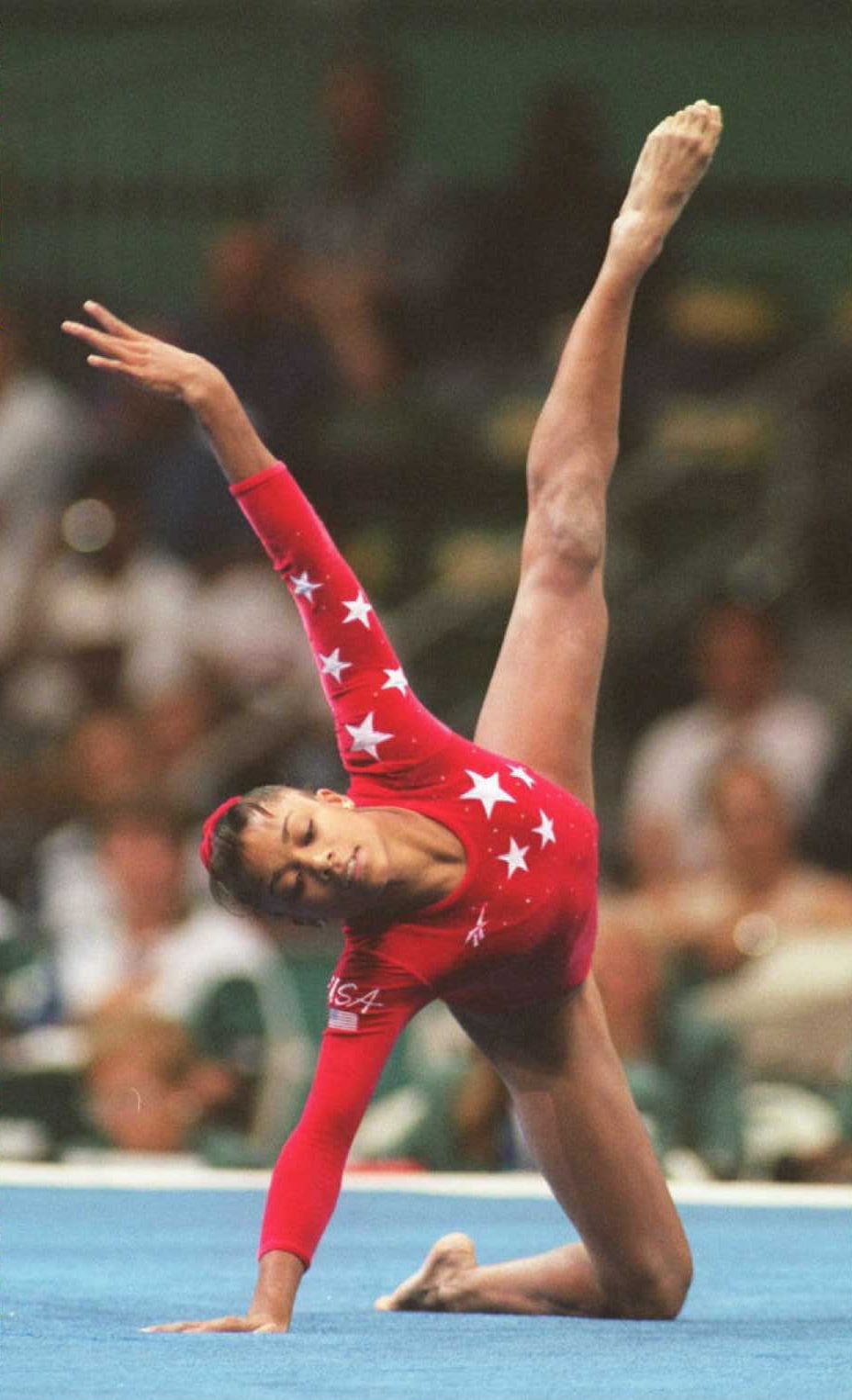 ATLANTA, GA - JULY 30:  Dominique Dawes of the US performs her routine in the Olympic individual floor event 29 July. Dawes took the bronze. (FOR EDITORIAL USE ONLY) AFP-IOPP/Eric FEFERBERG  (Photo credit should read AF/AFP via Getty Images)