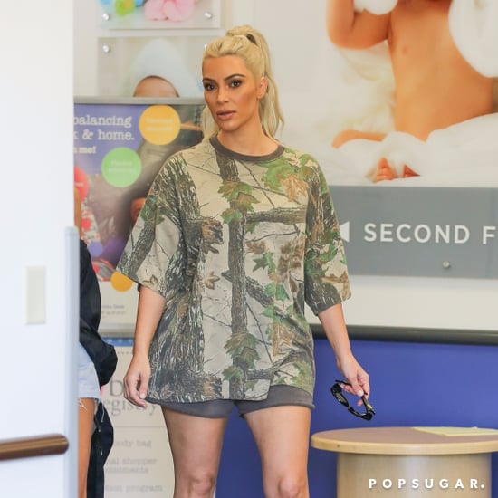 Kim Kardashian Beige Lace-Up Boots and Sweat Shorts