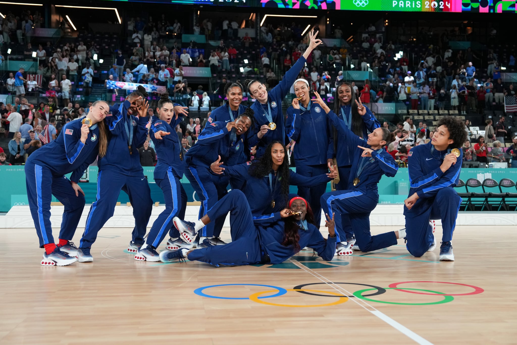 PARIS, FRANCE - AUGUST 11: The USA Women's National Team poses for a photo after winning the Women's Gold Medal Game on August 11, 2024 at the AccorHotels Arena in Paris, France. NOTE TO USER: User expressly acknowledges and agrees that, by downloading and/or using this photograph, user is consenting to the terms and conditions of the Getty Images License Agreement. Mandatory Copyright Notice: Copyright 2024 NBAE (Photo by Jesse D. Garrabrant/NBAE via Getty Images)