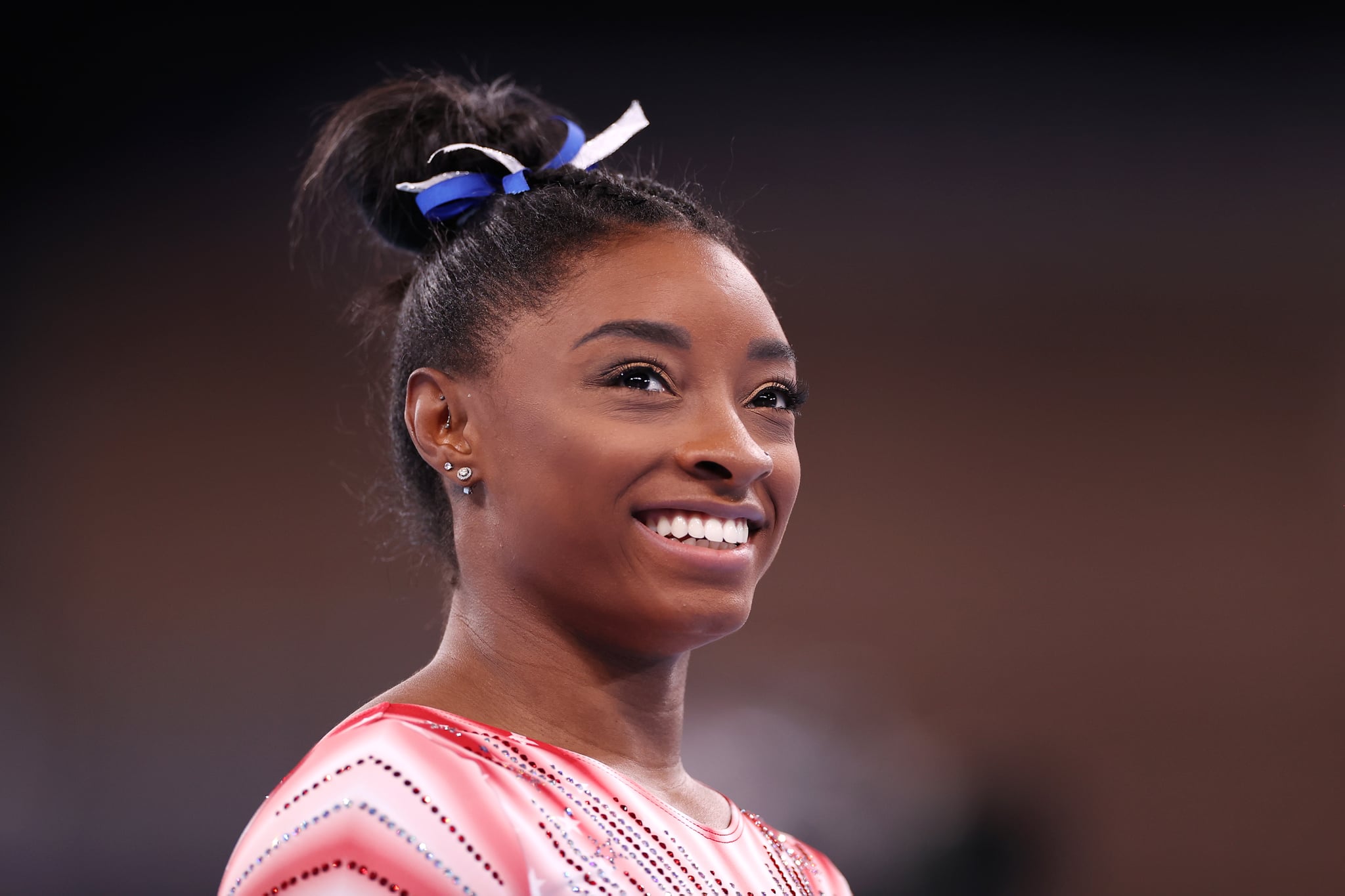 TOKYO, JAPAN - AUGUST 03: Simone Biles of Team United States looks on during warm-ups prior to the Women's Balance Beam Final on day eleven of the Tokyo 2020 Olympic Games at Ariake Gymnastics Centre on August 03, 2021 in Tokyo, Japan. (Photo by Laurence Griffiths/Getty Images)
