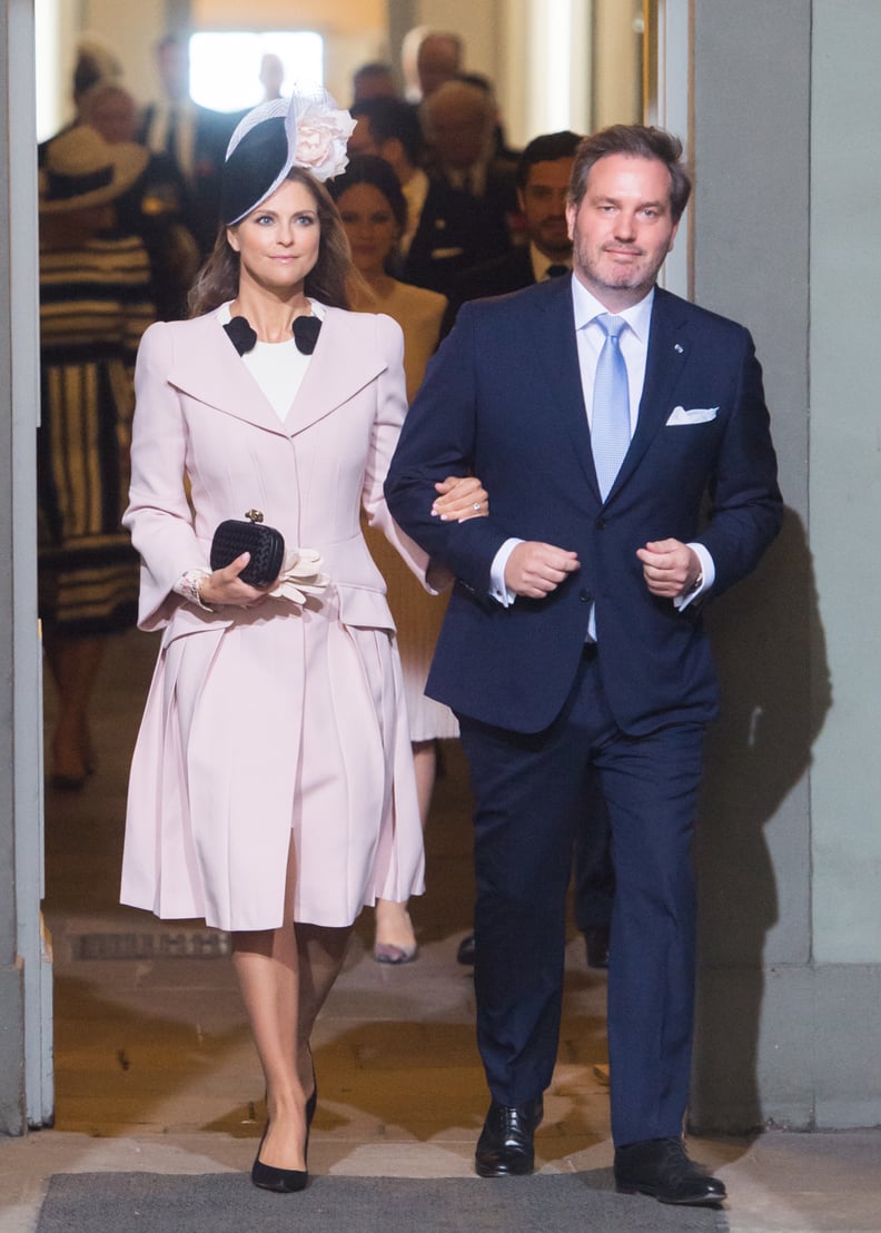 A Pink Pleated Coat Dress and Tall Fascinator