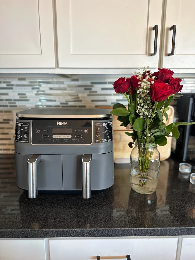 Ninja DZ201 Foodi 8 Quart 6-in-1 DualZone 2-Basket Air Fryer ($120, originally $200)
One of our editors was hardly exaggerating when she called this dual air fryer the secret to her happy marriage. It features two independent baskets that allow you to cook separate entrées at once and schedule them to finish simultaneously. The setup makes it easy for couples or families with different tastes to still enjoy a meal together. Learn more in our Ninja DZ201 Foodi 8 Quart 6-in-1 DualZone 2-Basket Air Fryer review.
Editor Quote: "There's so much I like about the Ninja Foodi DZ201 Air Fryer, starting with its dual-basket design. It's super convenient because my husband and I tend to eat different proteins. He tends to stick with chicken, and me, salmon, and with this air fryer, we can cook them simultaneously. Before, we'd have to cook them one at a time, or differentiate cooking methods, such as baking one and air-frying the other." — Marisa Petrarca, contributing shopping editor