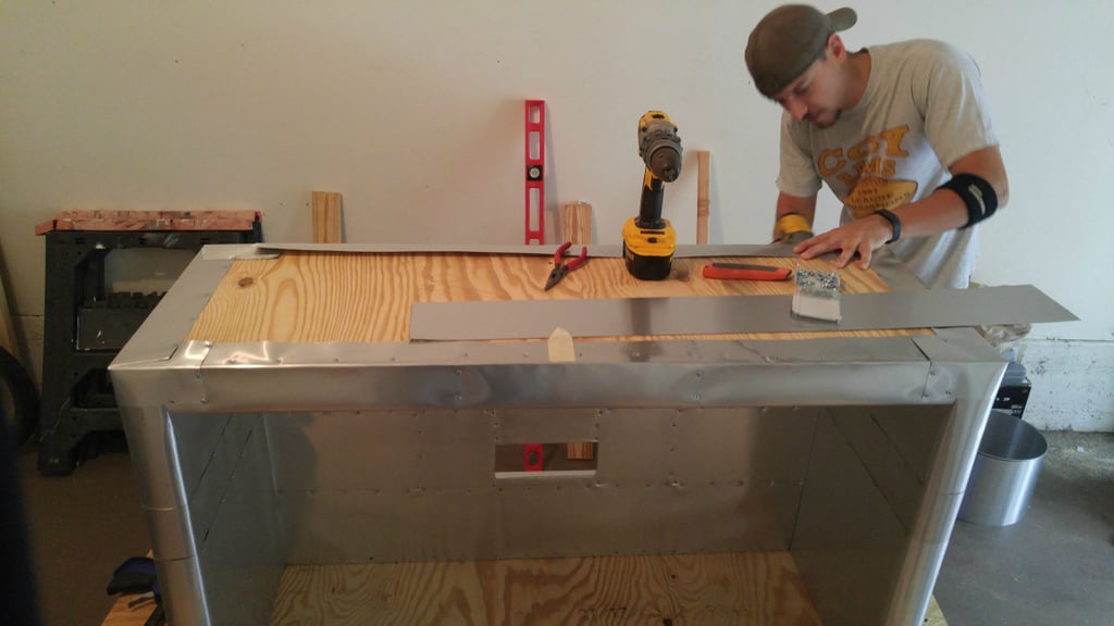 TV stand upside-down and wrapping the bottom edges up: