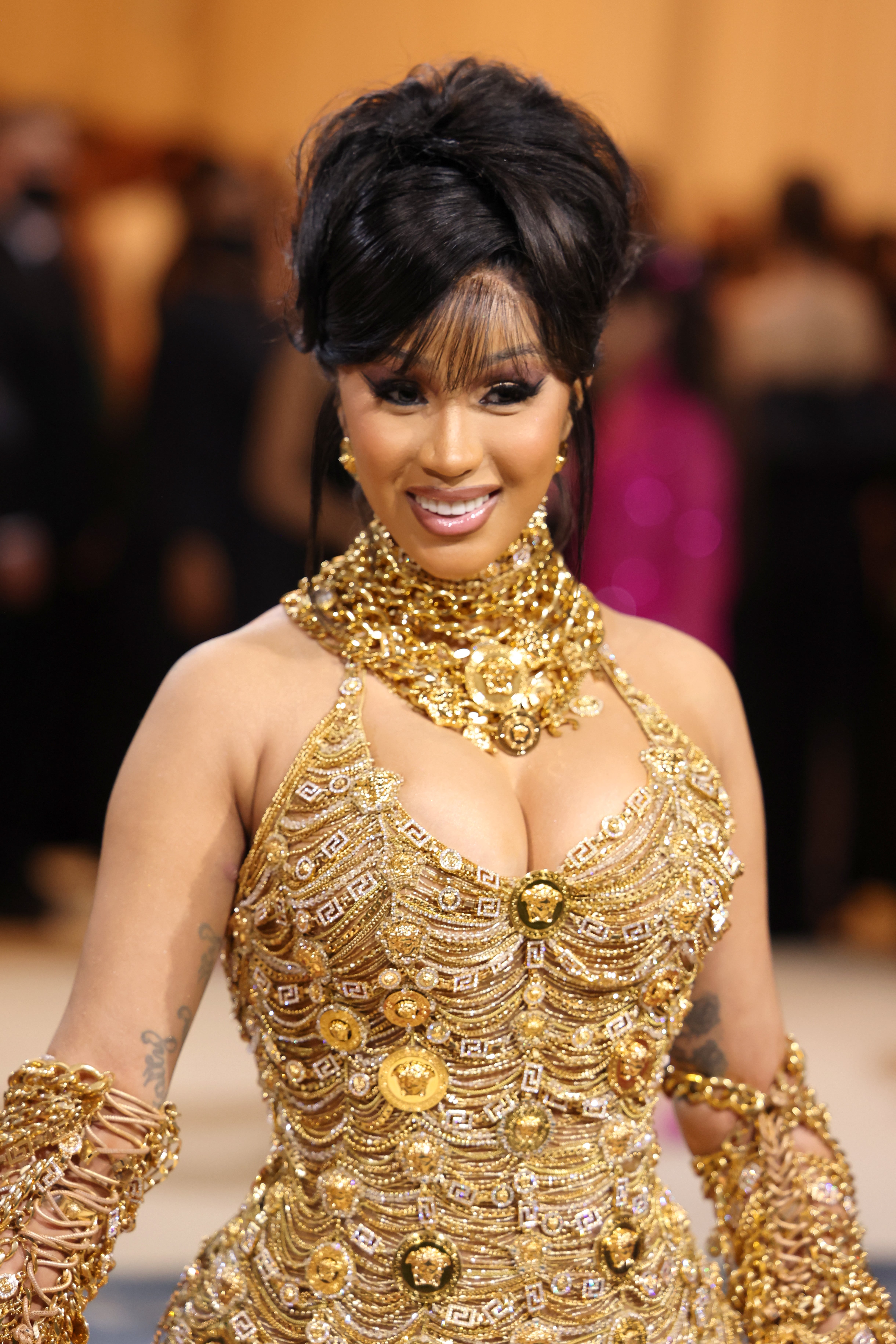 Cardi B Glitters in Gold Versace Gown for 2022 Met Gala