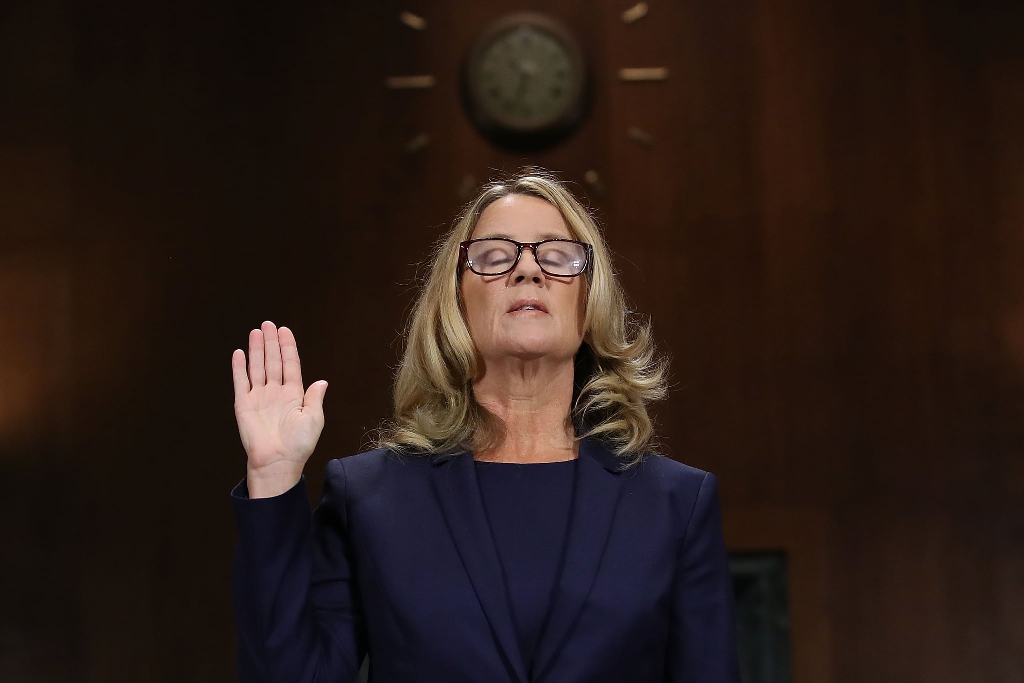 WASHINGTON, DC - SEPTEMBER 27:  Christine Blasey Ford is sworn in before testifying the Senate Judiciary Committee in the Dirksen Senate Office Building on Capitol Hill September 27, 2018 in Washington, DC. A professor at Palo Alto University and a research psychologist at the Stanford University School of Medicine, Ford has accused Supreme Court nominee Judge Brett Kavanaugh of sexually assaulting her during a party in 1982 when they were high school students in suburban Maryland. In prepared remarks, Ford said, ÒI donÕt have all the answers, and I donÕt remember as much as I would like to. But the details about that night that bring me here today are ones I will never forget. They have been seared into my memory and have haunted me episodically as an adult.Ó  (Photo by Win McNamee/Getty Images)