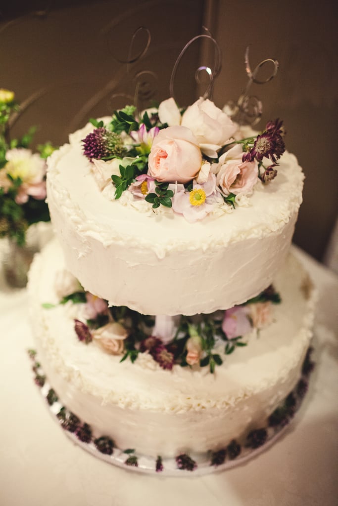 Peonies, roses, and a scattering of wild flowers give this cake a vintage look.