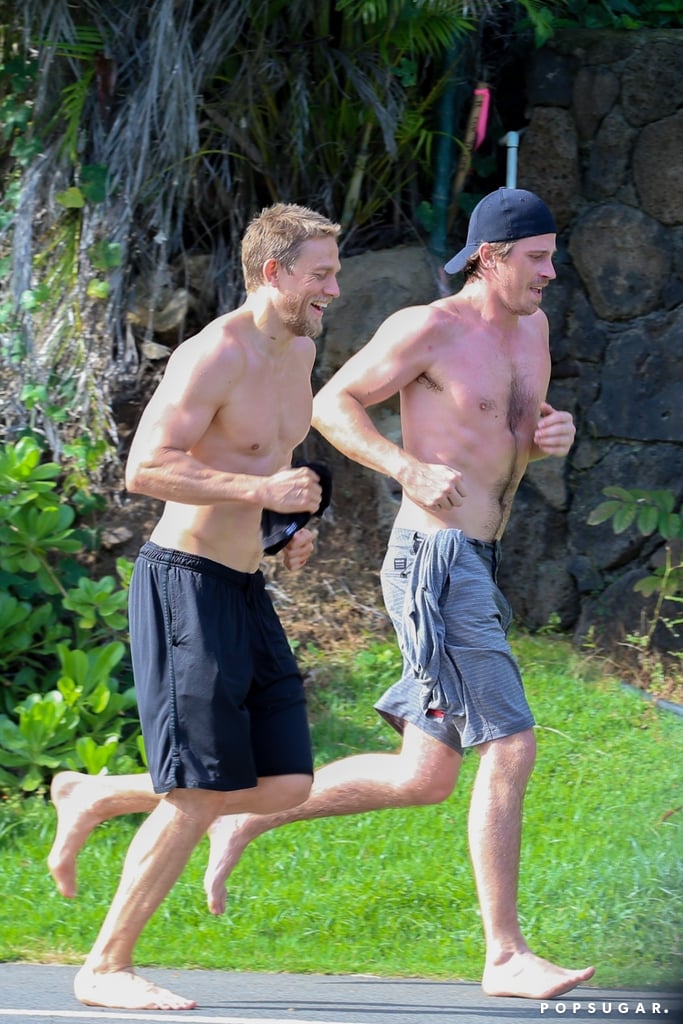 No shirt, no shoes, no problem for Charlie Hunnam and Garrett Hedlund, who went for a run together in Hawaii on Friday. The actors managed to flash some sexy smiles during their workout, both wearing shorts while jogging barefoot. Along with costars Ben Affleck and Oscar Isaac, the pair has been spending time in Hawaii while filming Triple Frontier, an upcoming Netflix movie. The cast was first spotted hanging out shirtless on the beach in March, and since then, there have been more than a few Charlie sightings, including a PDA-packed day for Charlie and his girlfriend, Morgana McNelis. Keep reading for a look at all the best pictures of Charlie and Garrett's outing, then check out even more sexy photos of Charlie Hunnam.
Related:
Charlie Hunnam Fans, These Shirtless Pictures Are Just . . . *Chef&apos;s Kiss*